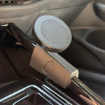 A close-up of a black magnetic phone mount attached to the center console of a MK8 GTI.